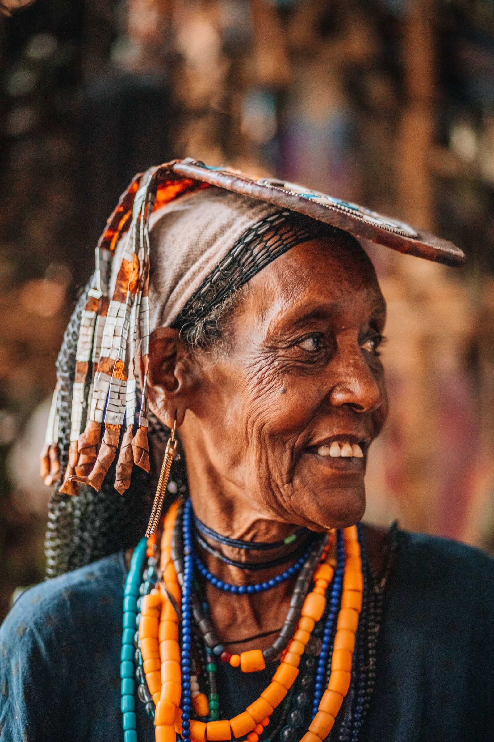 A smiling woman in a headscarf